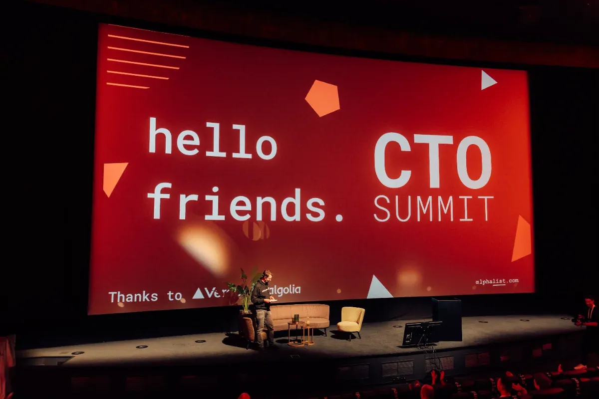 The CTO Summit stage with a hello friends title card