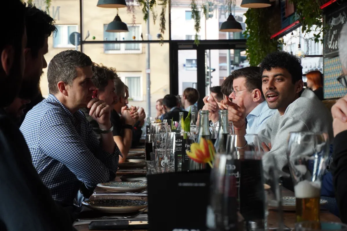 CTOs seated at a long dinner table during an alphalist gathering