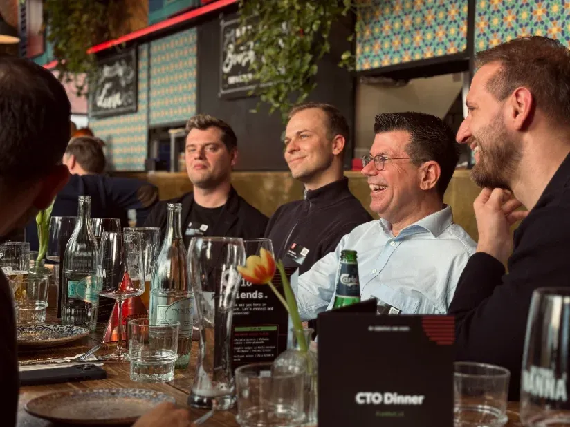 CTOs talking around a dinner table